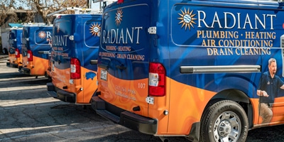 Lineup of Radiant Plumbing of Austin trucks
