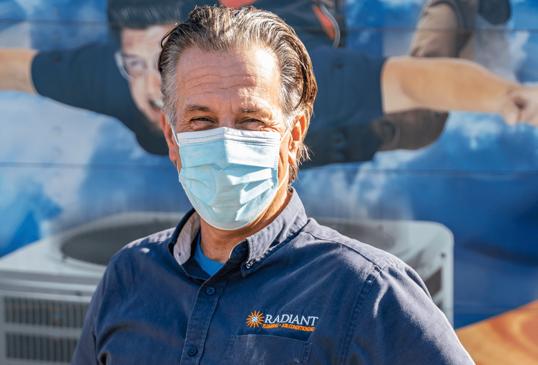 Radiant Plumber masked and looking at the camera while out in the field