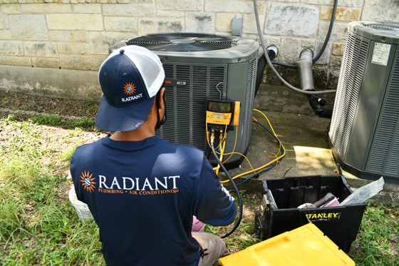 Radiant HVAC technician repairing an air conditioner
