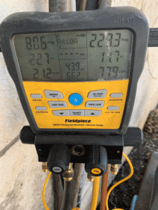 HVAC diagnostic gauges measuring refrigerant levels during AC repair in San Antonio TX