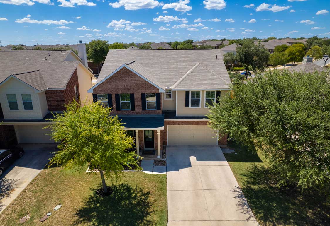 An aerial view of a home in a suburb
