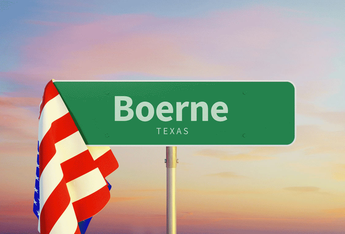 An illustrated image of a street sign that says Boerne Texas with the American flag