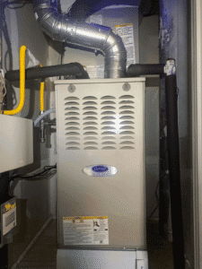 Carrier gas furnace installed in second-floor closet during HVAC system upgrade in Austin TX