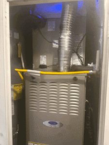 Carrier furnace installed in indoor utility closet with updated connections and airflow setup