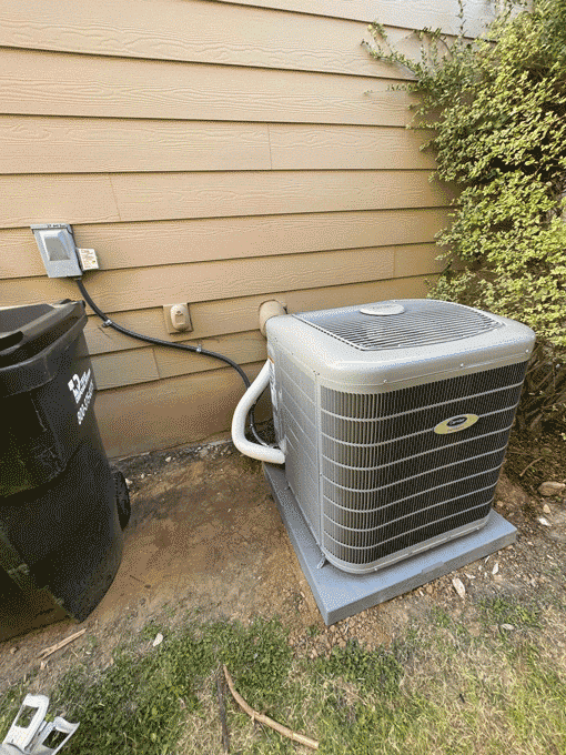 Carrier air conditioner installed on pad beside home in Austin TX during HVAC replacement