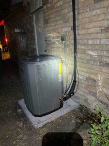 New Trane AC condenser installed on pad next to home in San Antonio