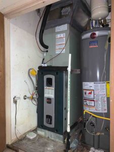 Trane variable-speed gas furnace installed inside garage during HVAC system replacement
