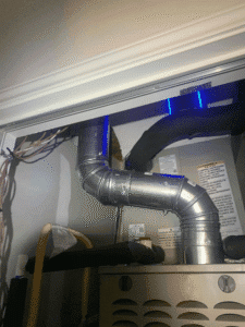 Indoor furnace with UV air purification light installed in ductwork for improved air quality