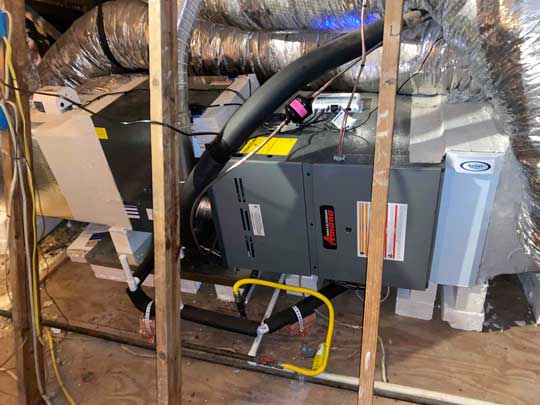 A new furnace and Air Filter installed in an attic
