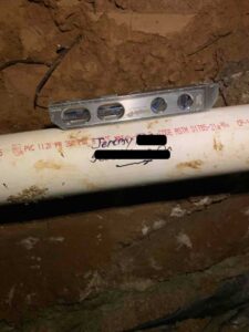 Marked and level sewer line pipes from the main line to the home