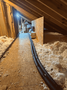 New insulated plumbing lines run through attic to support tankless water heater system