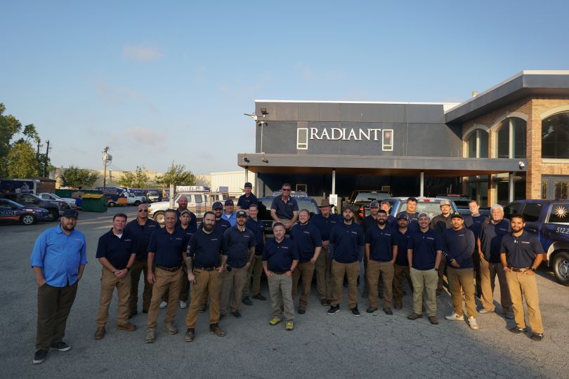 The Radiant Plumbing, Air Conditioning, & Electrical team outside the Austin location offices