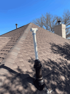Tankless water heater vent pipe installed through roof in Bulverde TX