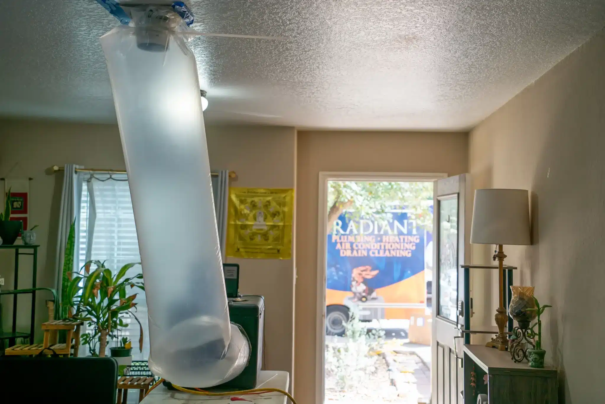 Aeroseal testing in a home while looking out the door at the Radiant Truck