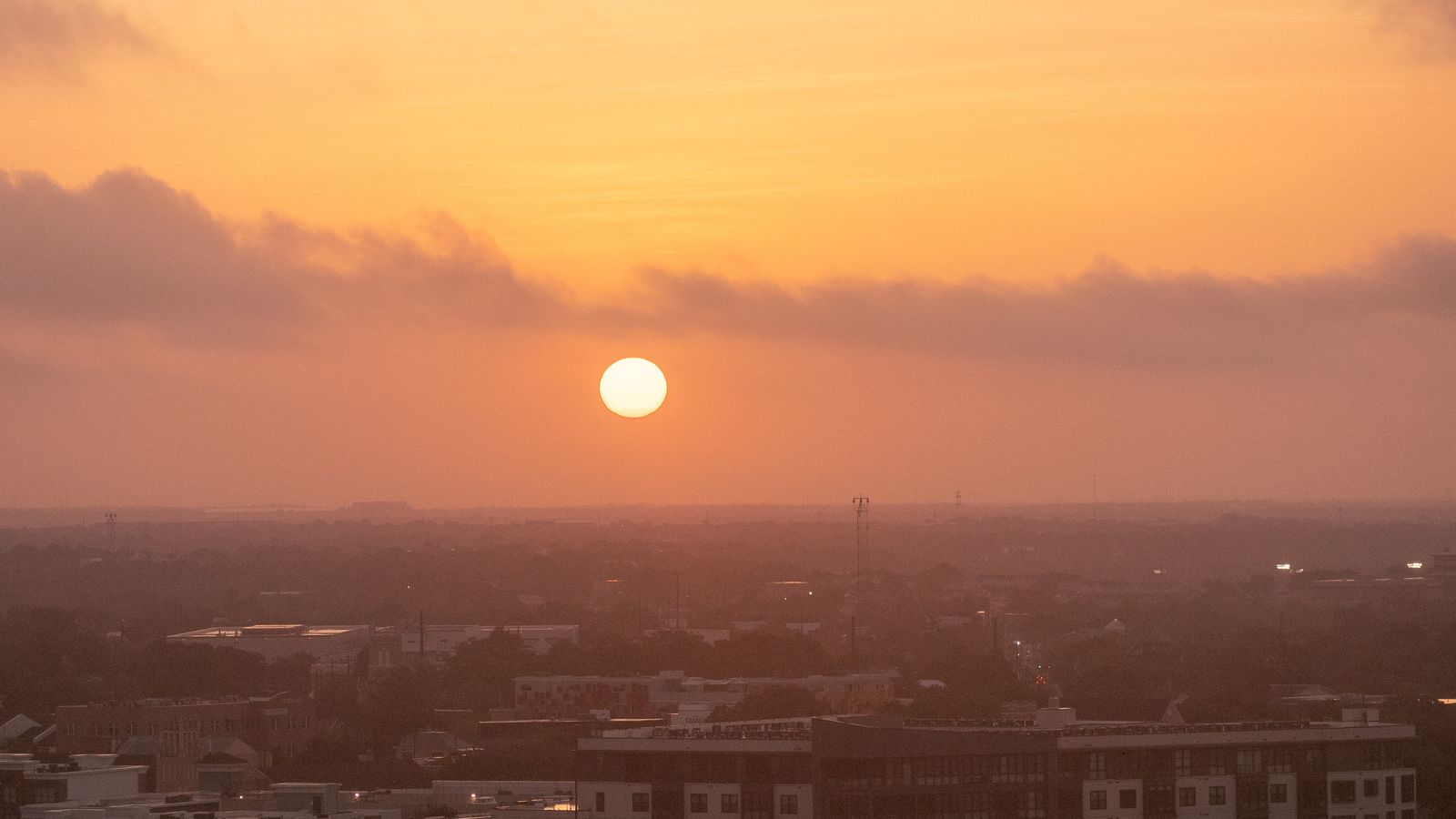 Sunrise over a hazy Austin TX scene