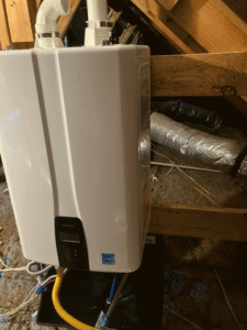 Tankless water heater installed in attic during Bulverde TX water heater upgrade