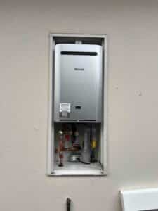 newly installed Rinnai tankless water heater with updated copper piping and valves