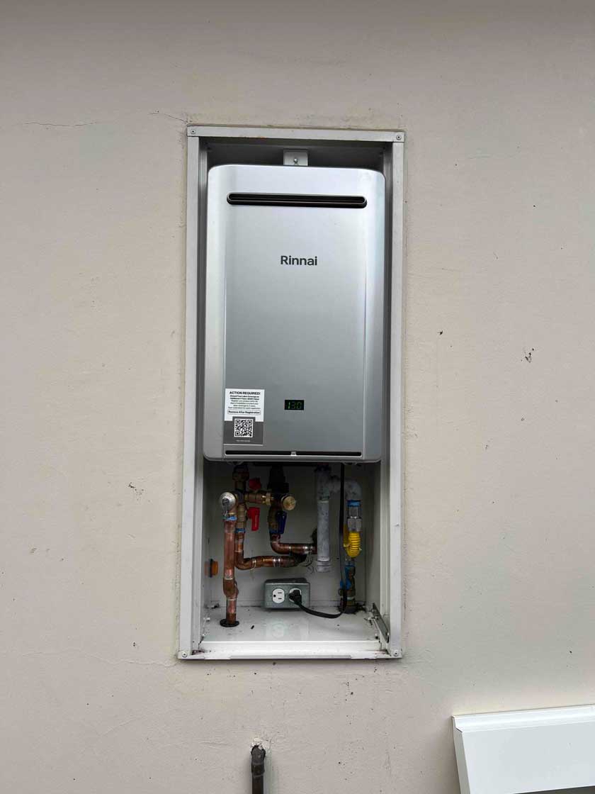 newly installed Rinnai tankless water heater with updated copper piping and valves
